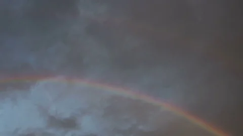 Rainbow with rain clouds, time lapse Stock Footage 83124832