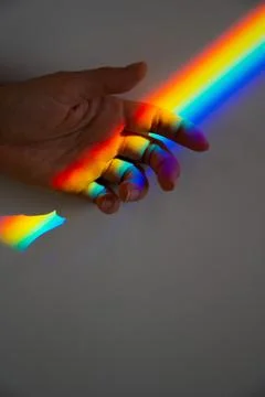 Rainbow ray on a woman's hand. Foto stock