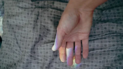 The rainbow is reflected on a man's hand close-up. Stock Footage 147671411