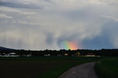 Rainbow reflection and rain cloud Foto stock