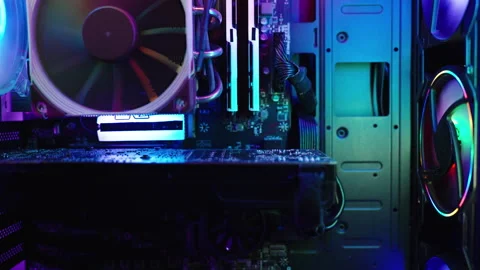 Rainbow RGB lighting inside the case of a gaming PC, components in the dark, zoo Stock Footage 266210892