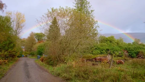 A Rainbow, seen after raining Stock Footage 99936375