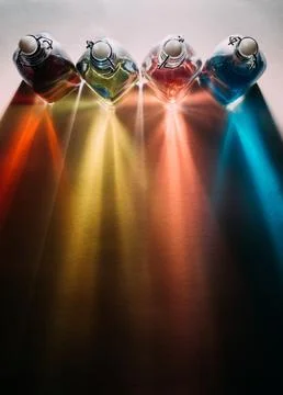 Rainbow shadows from glass bottles Stock Photos