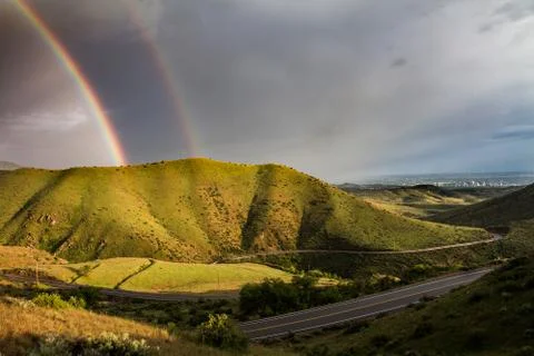 Rainbow shining on the mountain Stock Photos