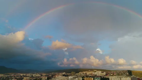 Rainbow in Sky Over Resort Southern City. Colors Of Rainbow. Flying on Drone Stock Footage 164635368