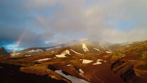 Rainbow in the snowy mountains Stock Footage 144845587