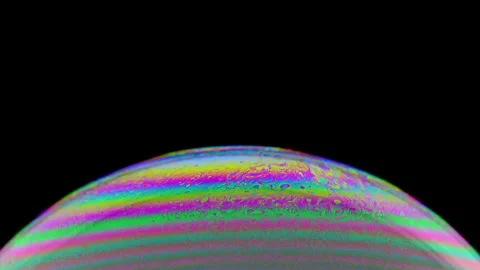 Rainbow soap bubble on a dark background. Stock Footage 130401979