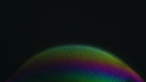 Rainbow soap bubble on a dark background. Close-up of colorful surface Stock Illustration