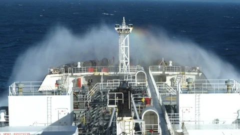 Rainbow spalsh of sea wave against a forward part of a ship. Stock Footage 120517252