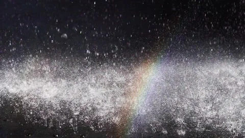 Rainbow, splashing water.  Slow motion heavy waterfall. Stock Footage 165321345