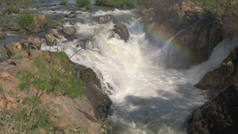 Rainbow spray at Li Phi Somphamit Falls Vídeos de archivo 334997975