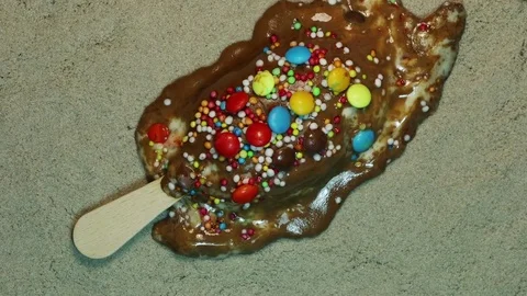 Rainbow Sprinkle Ice Cream Bar Melts into a Puddle Stock Footage 75690671