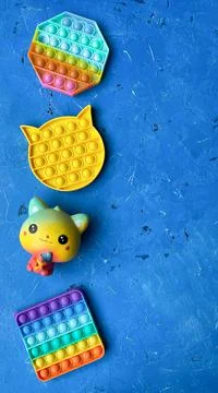Rainbow Square Cat shape Fidget Toys Pop-it on the gray background Stock-Fotos