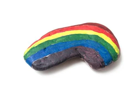 Rainbow on stone pebble on white background Stock Photos