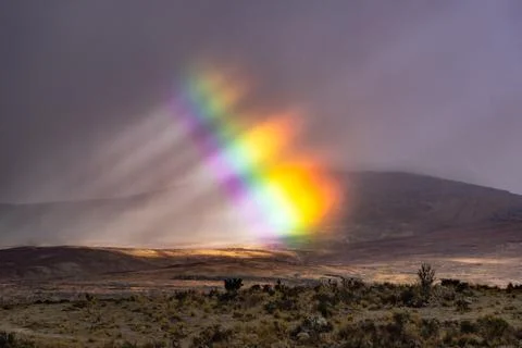 Rainbow into storm Foto stock