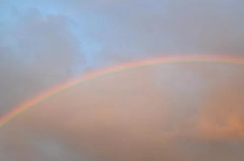 Rainbow on a stormy sky Stock Photos