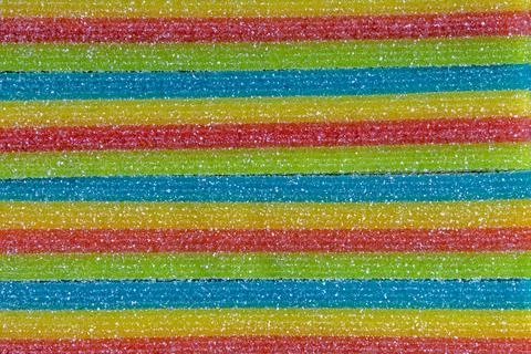 Rainbow sugar candy strips texture colorful sweet confectionery background Stock Photos