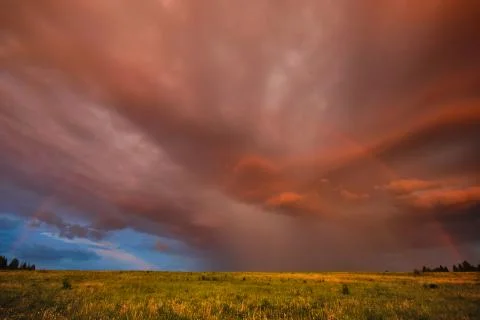 Rainbow in summer in the field Stock Photos