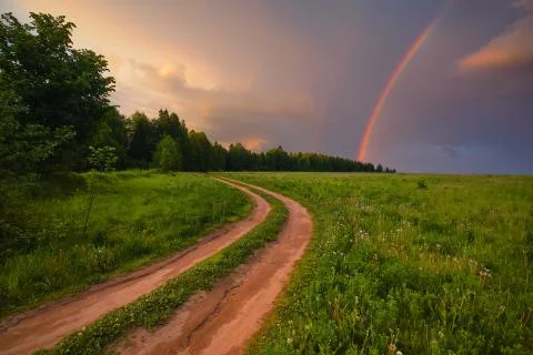 Rainbow in summer in the field Stock Photos