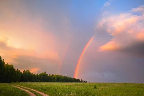 Rainbow in summer in the field Stock Photos