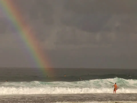 Rainbow with Surfer Stock Footage 25825676