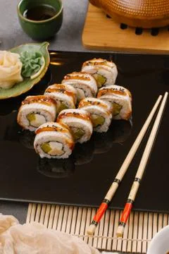Rainbow Sushi Roll with salmon, eel, tuna, avocado, royal prawn, cream cheese Stock Photos