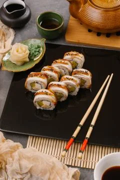 Rainbow Sushi Roll with salmon, eel, tuna, avocado, royal prawn, cream cheese Stock Photos