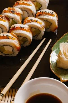 Rainbow Sushi Roll with salmon, eel, tuna, avocado, royal prawn, cream cheese Stock Photos