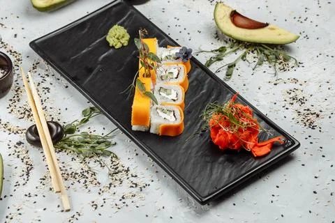 Rainbow Sushi Roll with salmon, eel, tuna, avocado, royal prawn, cream cheese Stock Photos