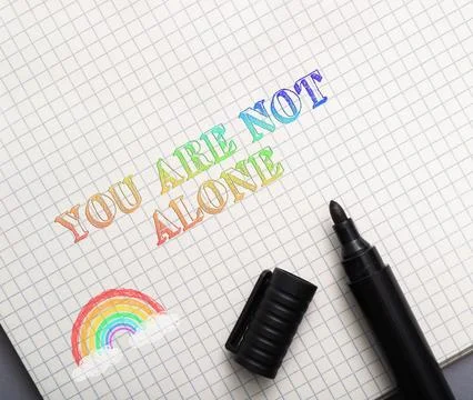 Rainbow Text Message of Support on Grid Paper Stock Photos