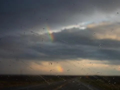 Rainbow Through Rain Covered Window Stock Photos