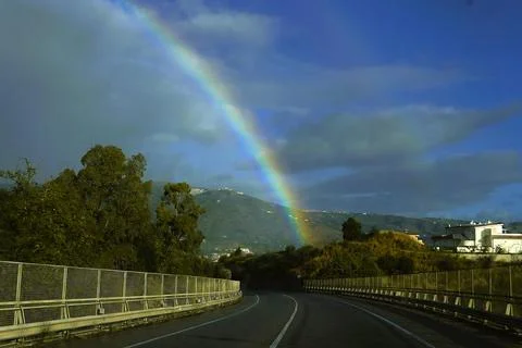 A rainbow through a wet car windshield. 스톡 사진