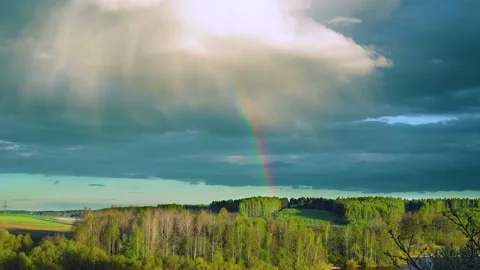 Rainbow time lapse after a spring thunderstorm. High quality FullHD footage Stock Footage 234786048