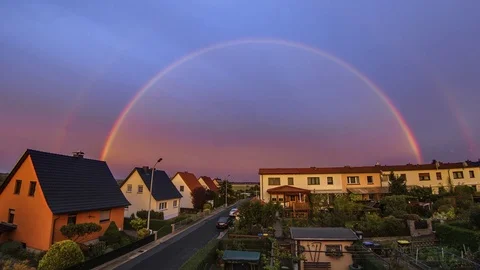 Rainbow Timelapse Over Small Town At Sunset 4K Vídeos de archivo 80458146