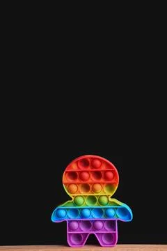 Rainbow toy pop it on a black background. mock up Stock Photos