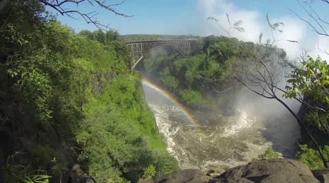 Rainbow under Knife Edge bridge with mist from Victoria Falls Видео 22864880