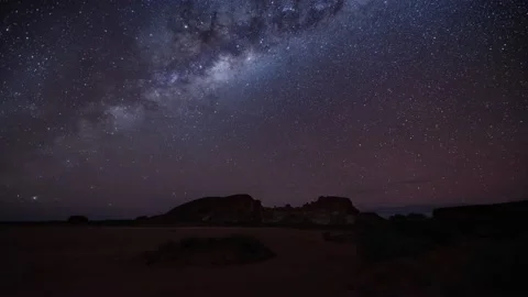 Rainbow valley in Australia under milkyway in a timelapse video 8K video Stock Footage 130682113