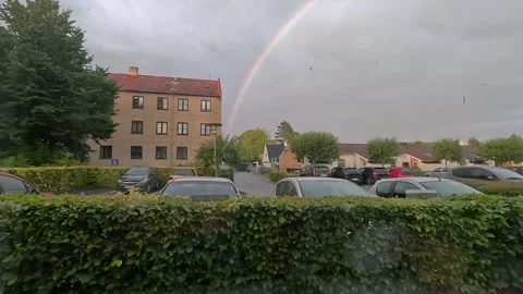 Rainbow. View from the window to the rainbow on a cloudy day. Stock Footage 249261597