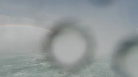 Rainbow in violent mist at Niagara Falls, shot from boat at closest point. Stock Footage 320002819