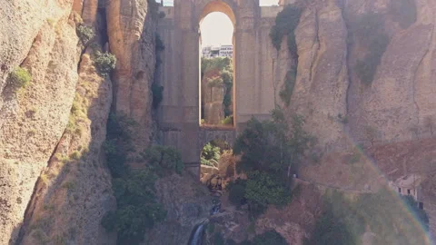 Rainbow in the waterfall spray inside the Ronda gorge Stock Footage 347758542