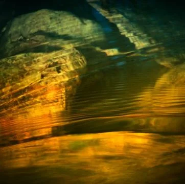 Rainbow wavelets in water Stock Photos