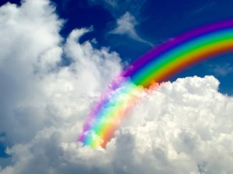 Rainbow in white cloud blue sky background Foto stock