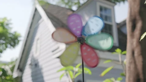 Rainbow windmill in the garden Stock Footage 143151096
