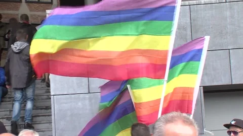 Rainbowflags waving in the wind during a gay pride Stock Footage 132319300