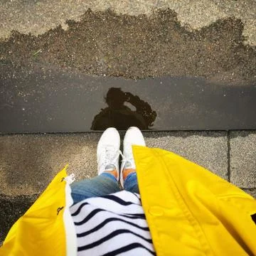 Raincoat and reflection Stock Photos