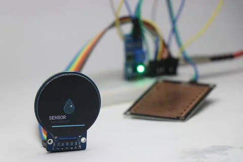 Raindrop detection sensor connected to round lcd display Stock Photos