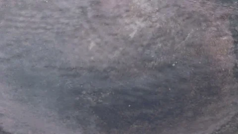 Raindrop falling to bottom of big earthen jar Stock Footage 80308145