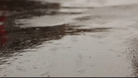 Raindrop splashes on the asphalt Stock Footage 7728189