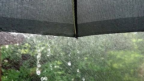 Raindrop under black umbrella slow motion Stock Footage 108380122