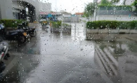 Raindrop on window blur motorcycle background Foto stock